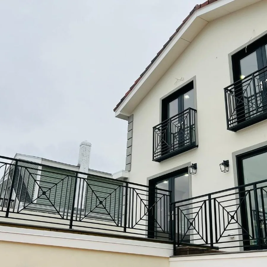Custom black balcony and deck railings on a luxury residence