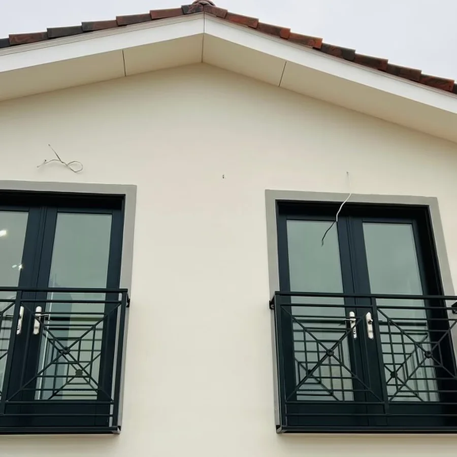 Black balcony railings on a residential exterior