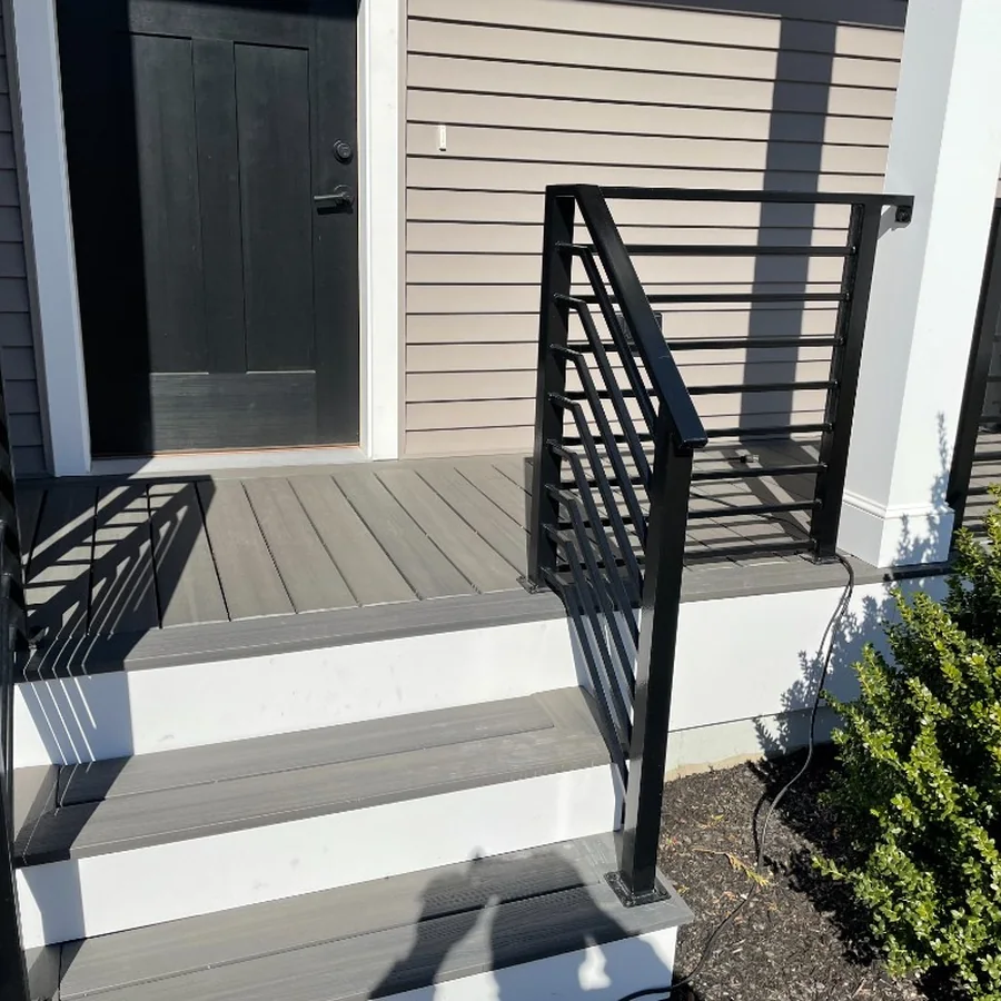 Black porch and stair railing on a residential entry